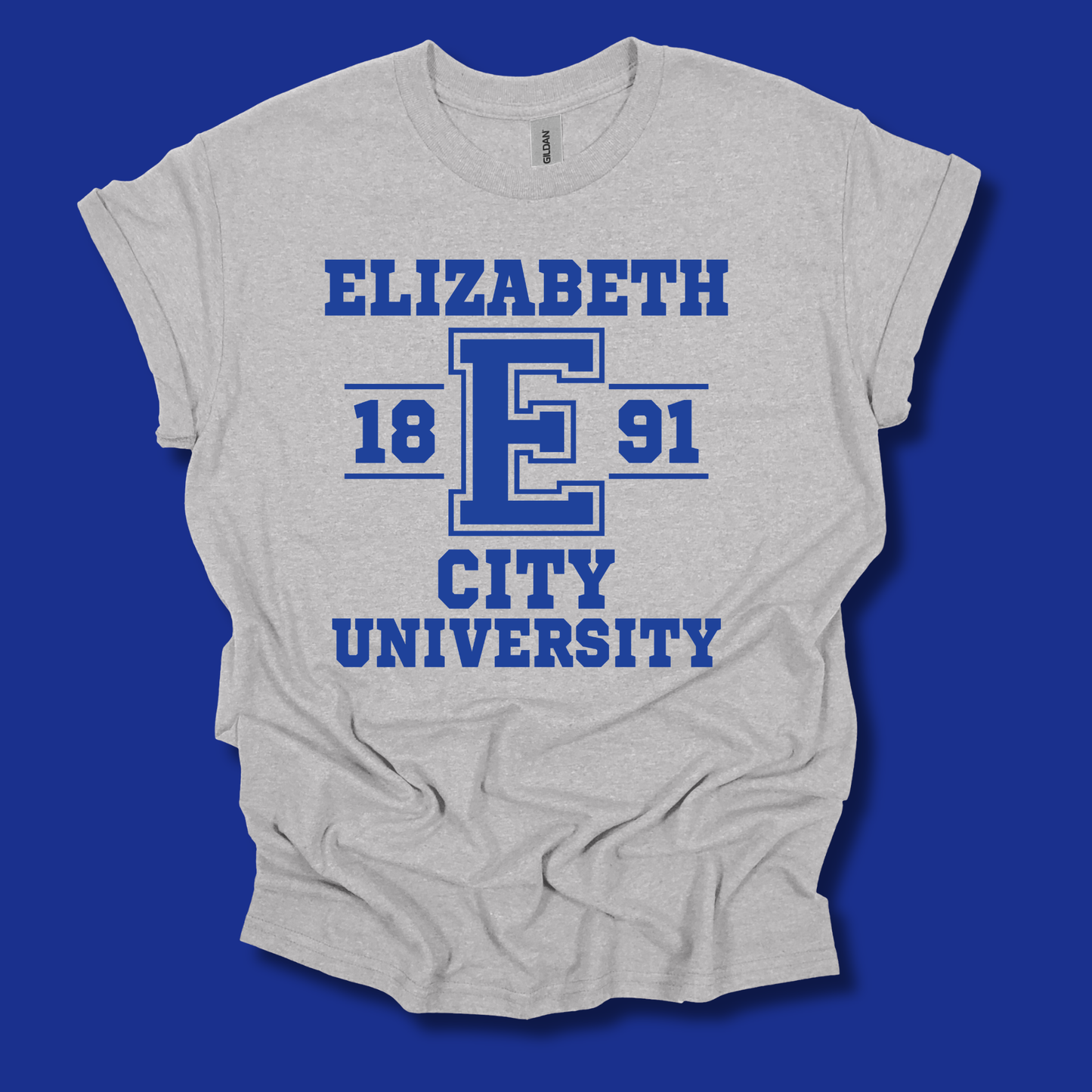 A light heather gray t-shirt with a blue graphic print reading 'ELIZABETH 18 E 91 CITY UNIVERSITY' on a solid blue background.