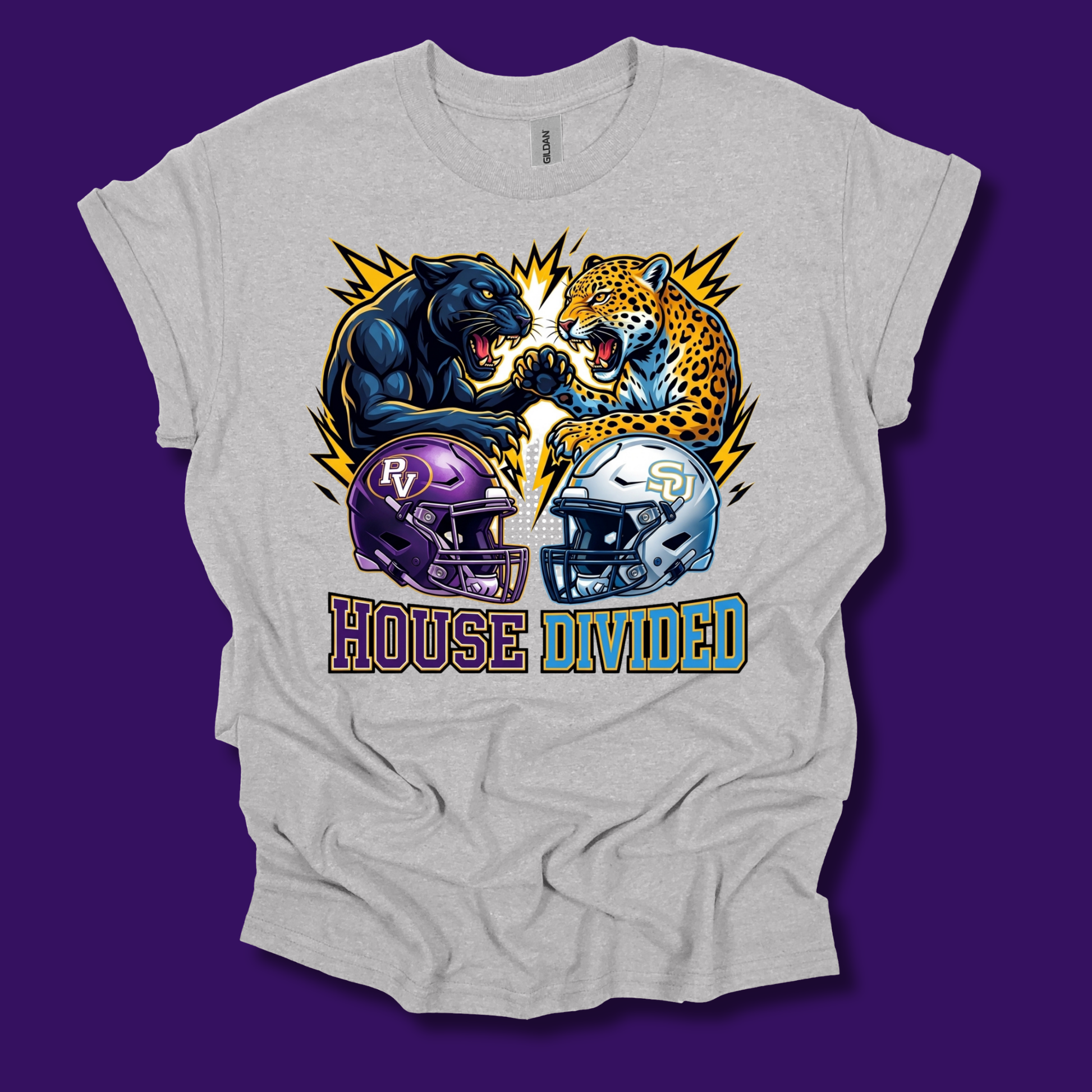 A light heather gray t-shirt with a graphic print of a black panther and a yellow leopard facing off, with purple and silver football helmets below and the text 'HOUSE DIVIDED'. The t-shirt is displayed flat against a solid dark purple background.