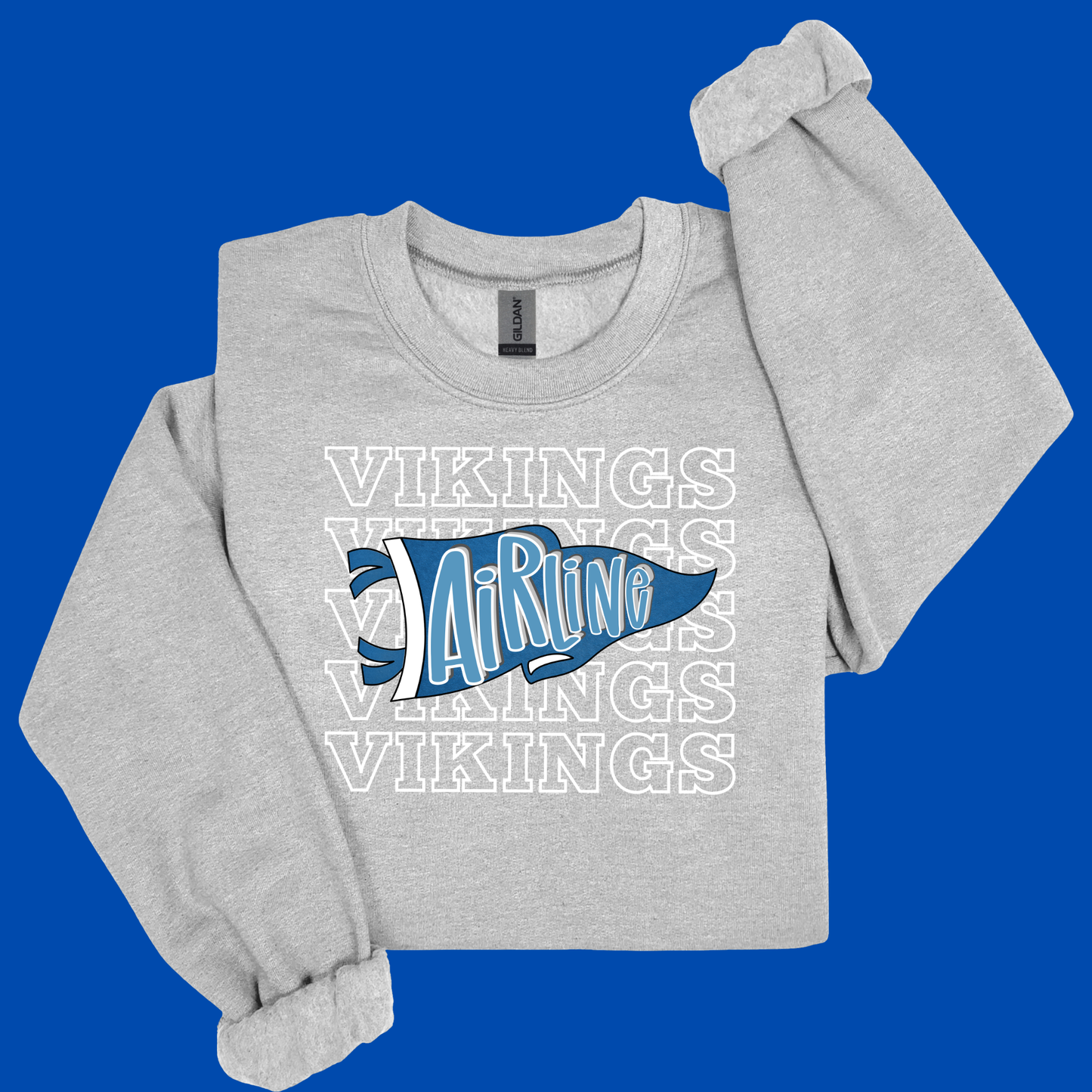 A light heather gray crewneck sweatshirt featuring a blue and white 'Airline' flag graphic with 'VIKINGS' text, displayed on a solid blue background.