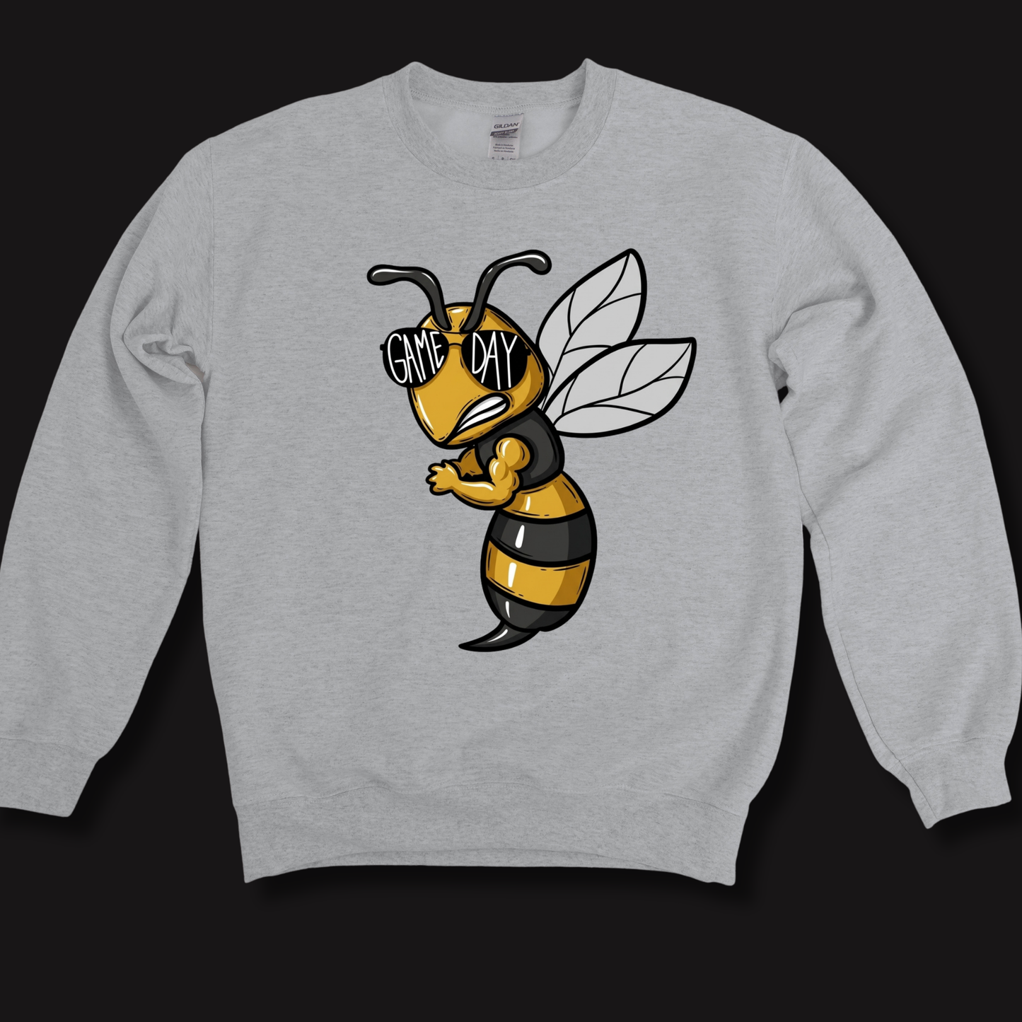 A light gray crewneck sweatshirt featuring a cartoon graphic of a bee wearing black and yellow stripes and sunglasses with the text 'GAME DAY' on the chest, displayed against a solid black background.