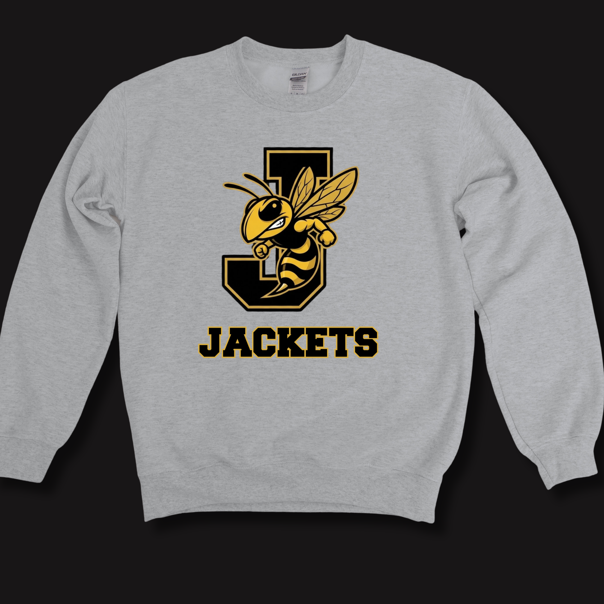 A light gray crewneck sweatshirt featuring a large graphic of a yellow and black bee mascot on a black letter 'J' with the word 'JACKETS' printed below in black with a yellow outline, displayed against a solid black background.