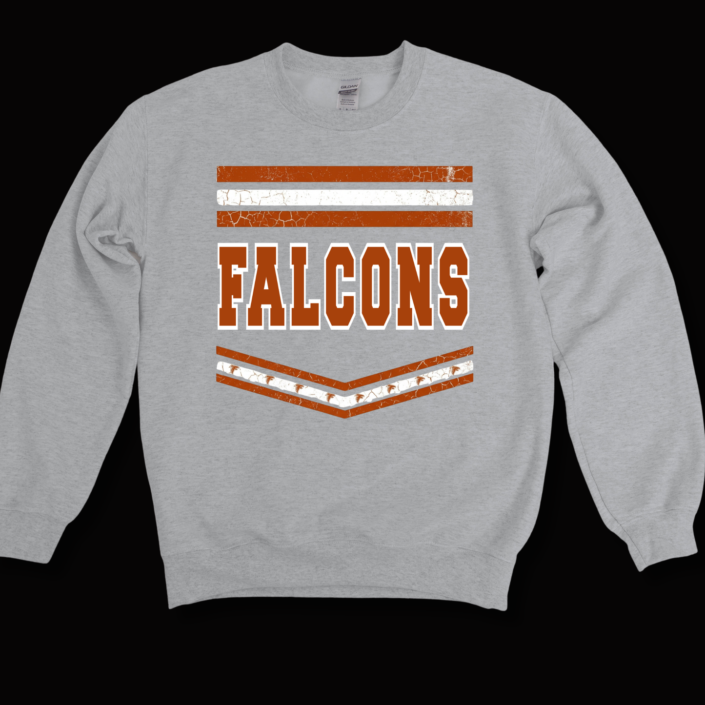 A light gray crewneck sweatshirt featuring a distressed orange and white graphic on the chest with the word 'FALCONS' and horizontal stripes, shown against a solid black background.