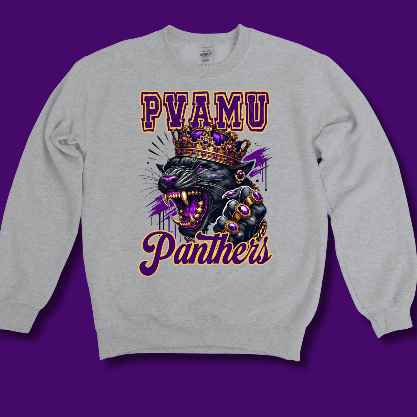 A light heather gray crewneck sweatshirt featuring a graphic print of a roaring black panther wearing a gold crown, with purple and gold text reading 'PVAMU Panthers' on a solid purple background.