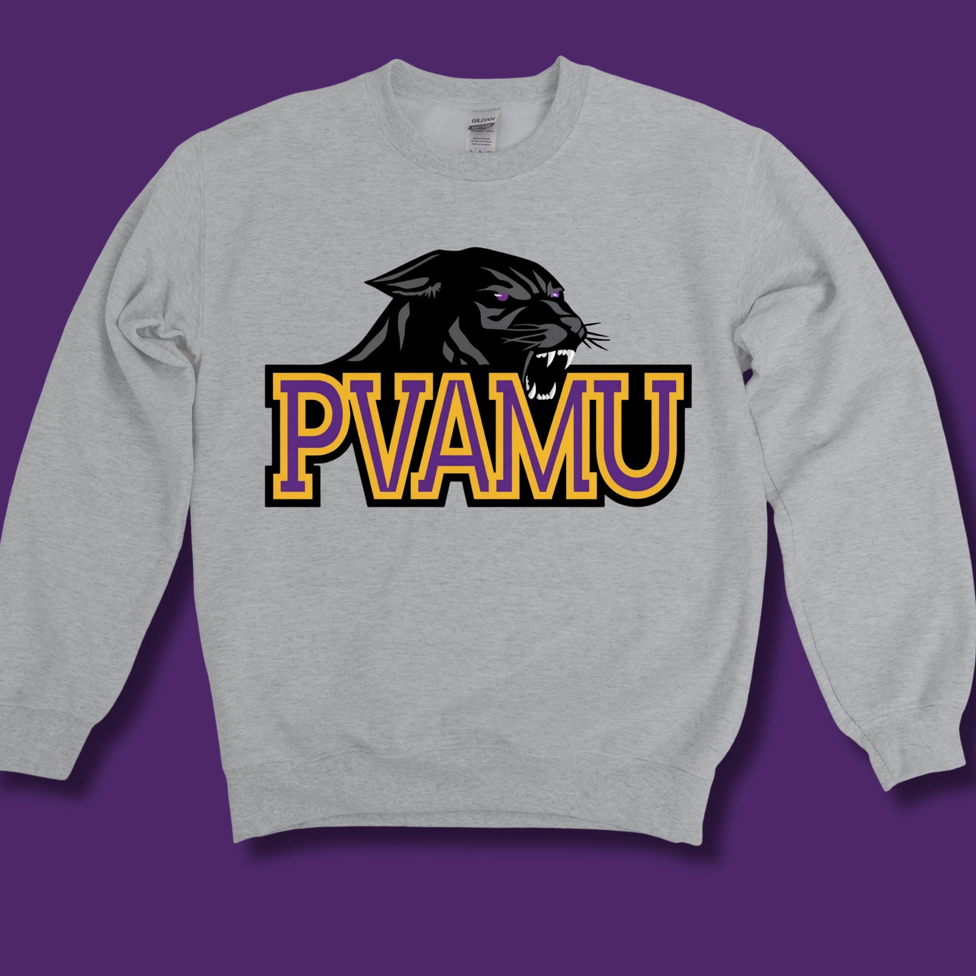 A light heather gray crewneck sweatshirt featuring a graphic of a black panther head above the text 'PVAMU' in yellow and purple block letters with a black outline, displayed against a solid purple background.