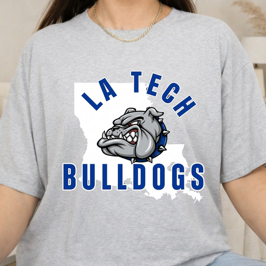 A person wearing a light heather gray t-shirt with a 'LA TECH BULLDOGS' graphic on the front, featuring a bulldog mascot over a white Louisiana state outline.