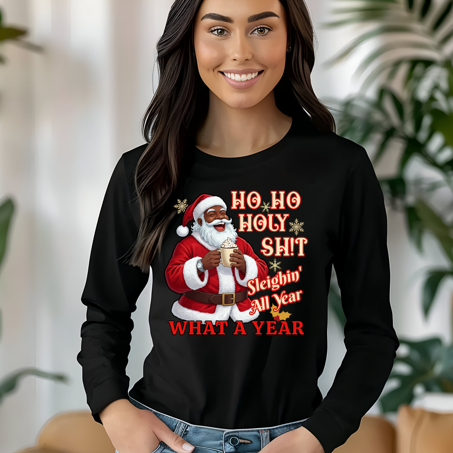 Woman wearing a black long-sleeve shirt with a graphic of Santa Claus and text.