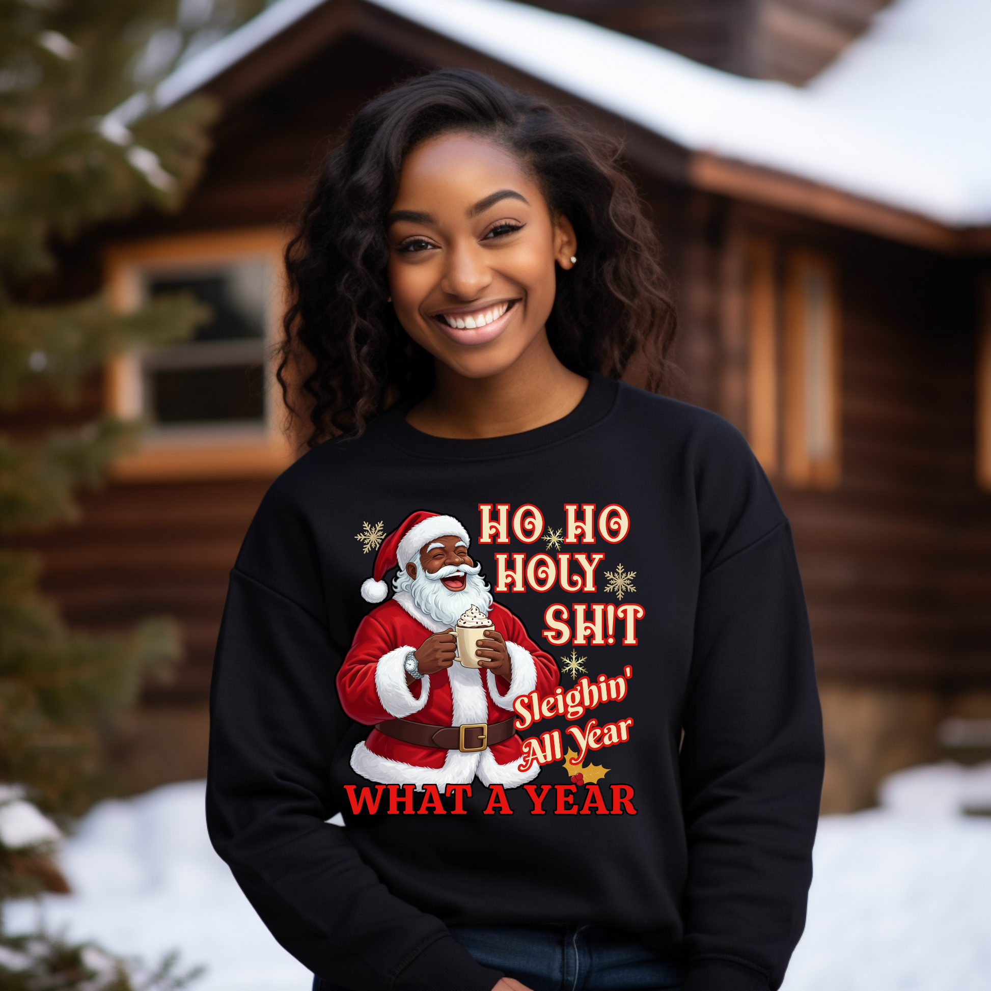 Person wearing a black sweatshirt with a Christmas-themed design in front of a wooden cabin.
