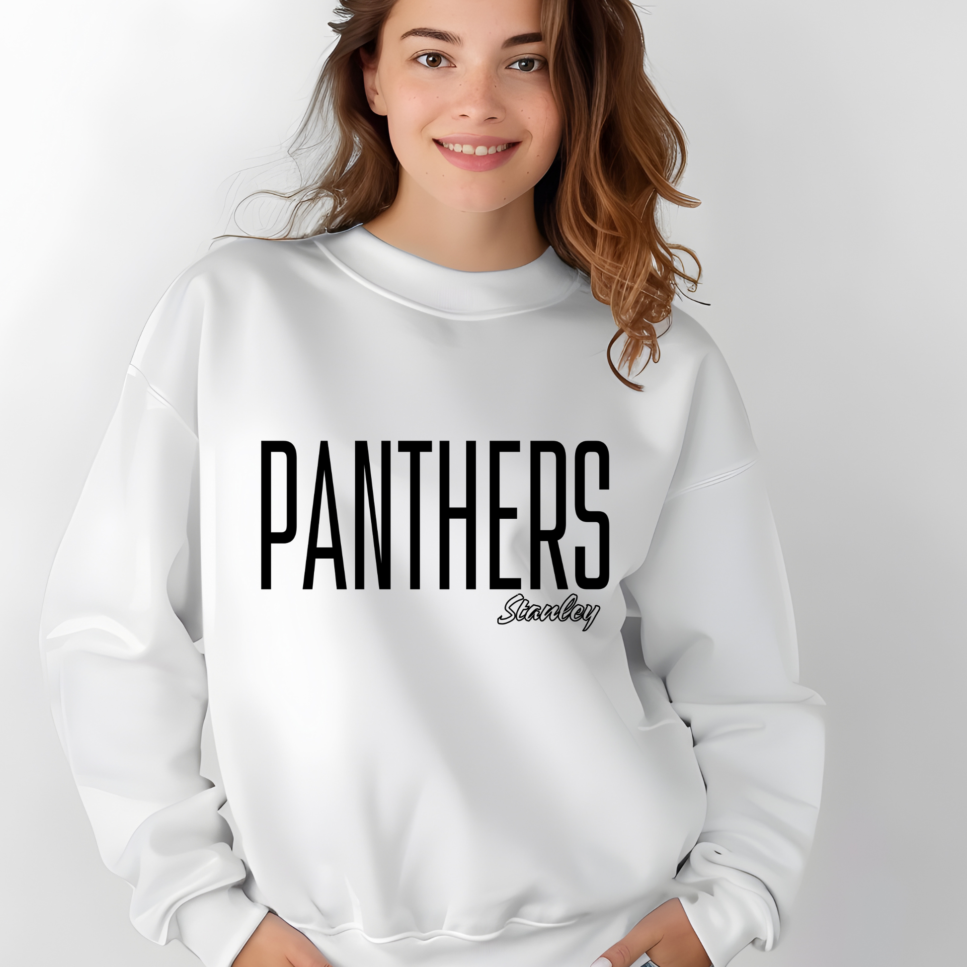 A woman wearing a white crewneck sweatshirt with 'PANTHERS' printed in bold black letters and 'Sandy' in a smaller script font underneath, set against a plain light gray background.