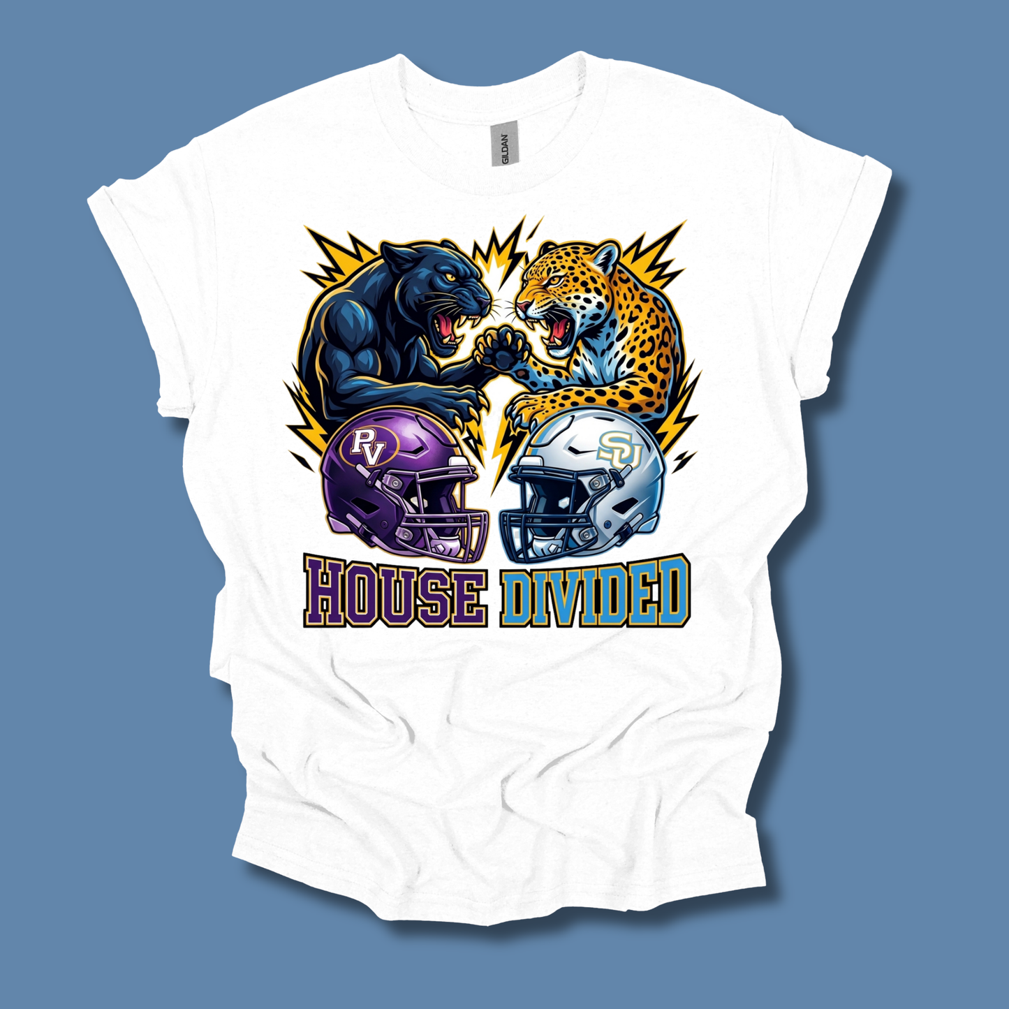 A white short-sleeve graphic t-shirt laid flat against a solid blue-gray background. The graphic features a black panther and a leopard roaring at each other, with purple and silver football helmets below them and the text 'HOUSE DIVIDED' underneath.