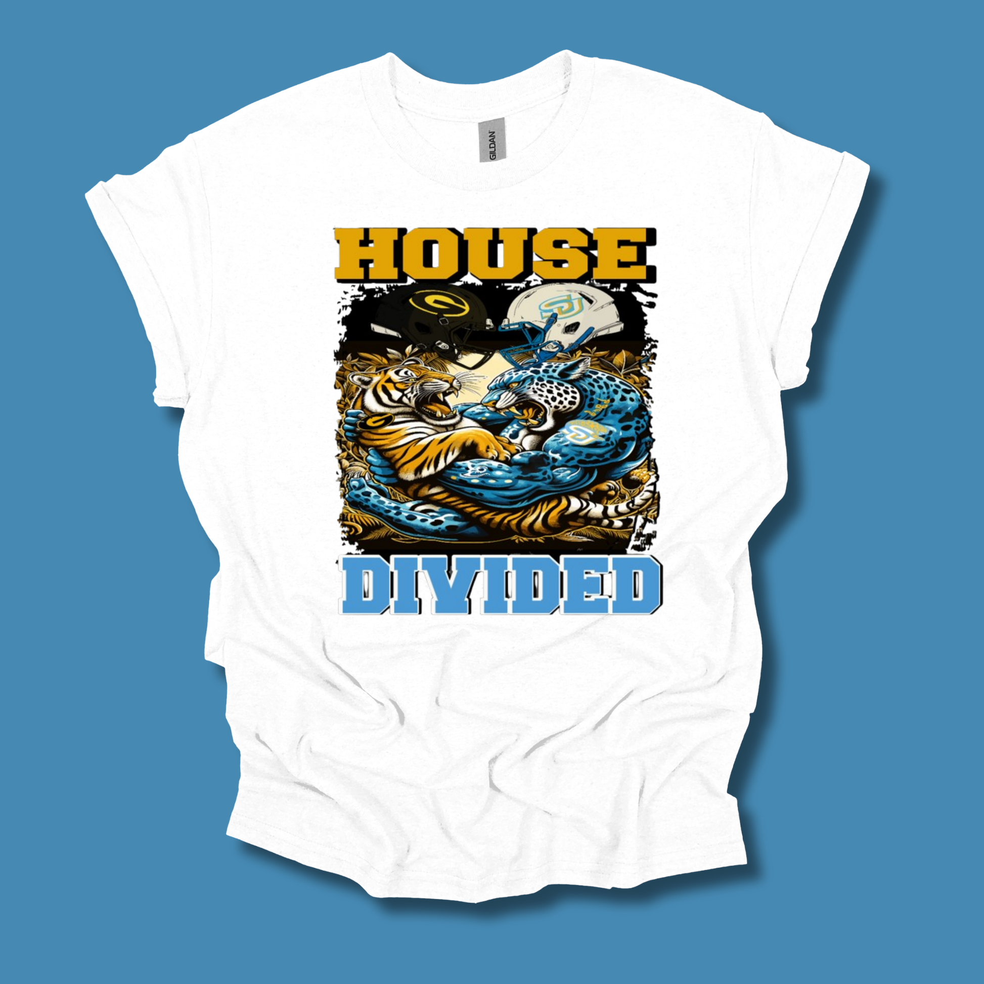 A white short-sleeve graphic t-shirt featuring a stylized band print for 'House Divided' with a tiger, skull, and blue waves, displayed against a solid blue background.