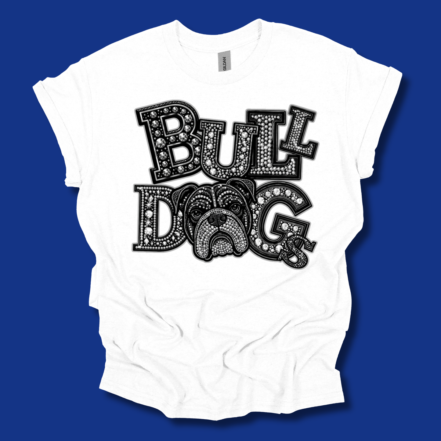 A white short-sleeve t-shirt with a black graphic reading 'BULLDOG' in a decorative dotted font, featuring a bulldog face integrated into the design, shown against a solid blue background.