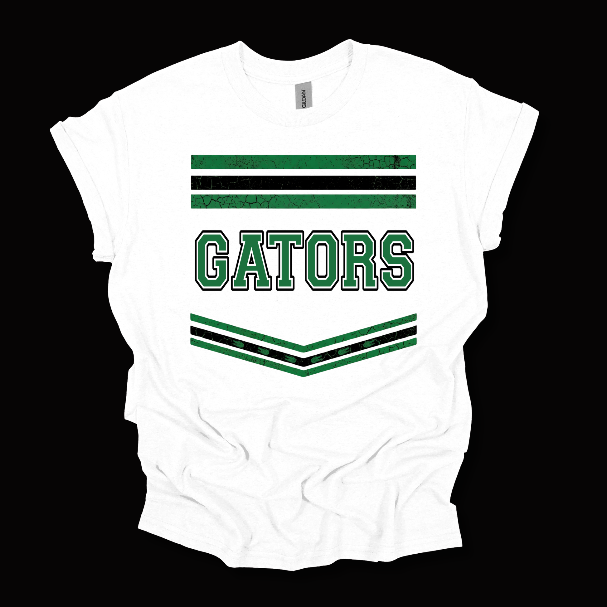 A white short-sleeve t-shirt with a green and black collegiate-style graphic featuring the word 'GATORS' and striped accents, shown against a solid black background.