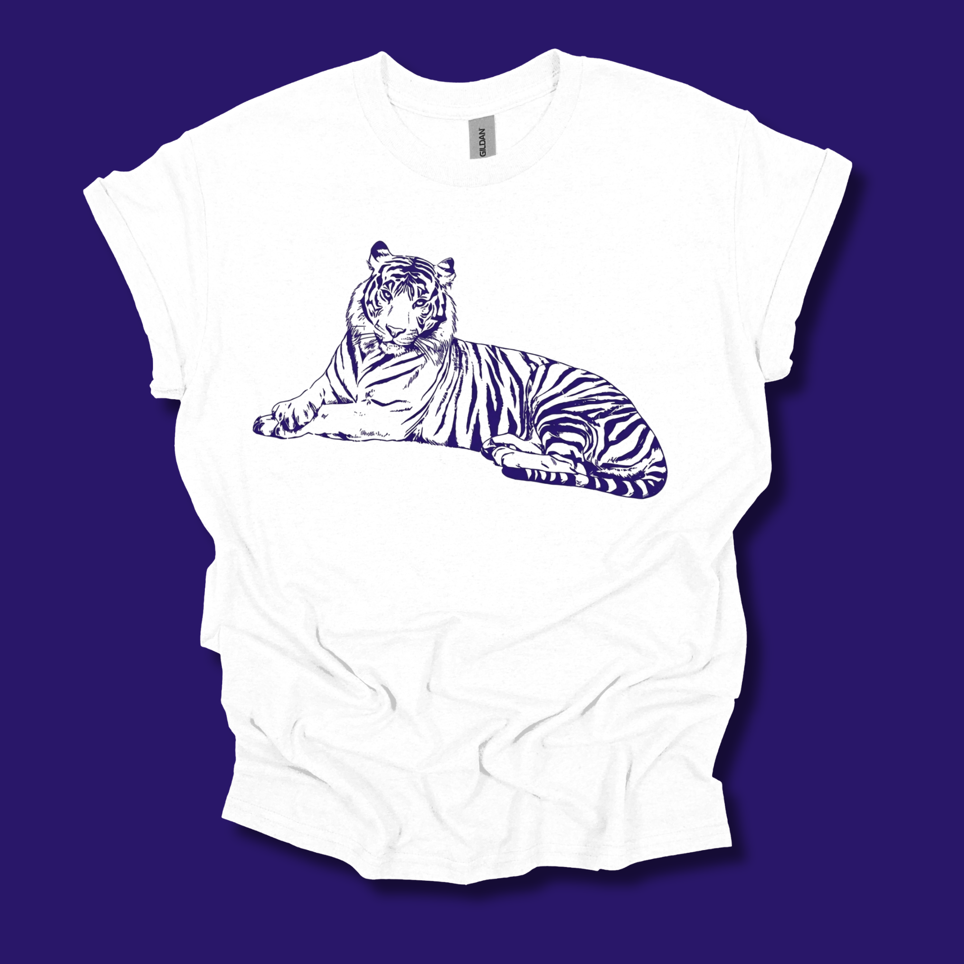 A white short-sleeve t-shirt with a dark blue line art graphic of a lying tiger on the chest, displayed flat against a solid dark purple background.
