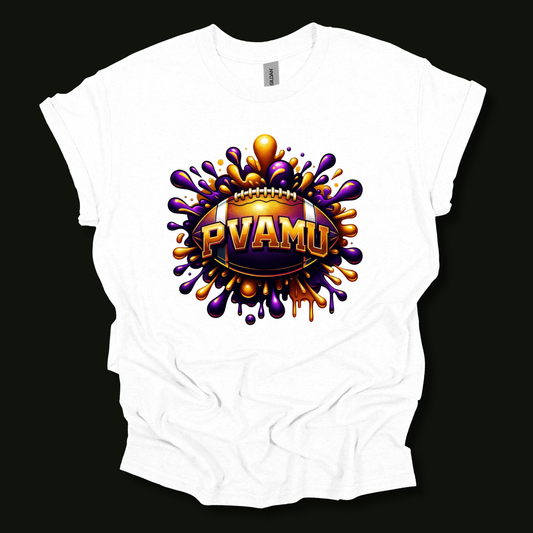 A white short-sleeve t-shirt with a large graphic print on the front. The graphic features a football-shaped badge with the text 'PVAMU' in gold, surrounded by a purple and orange paint splatter design, set against a solid black background.