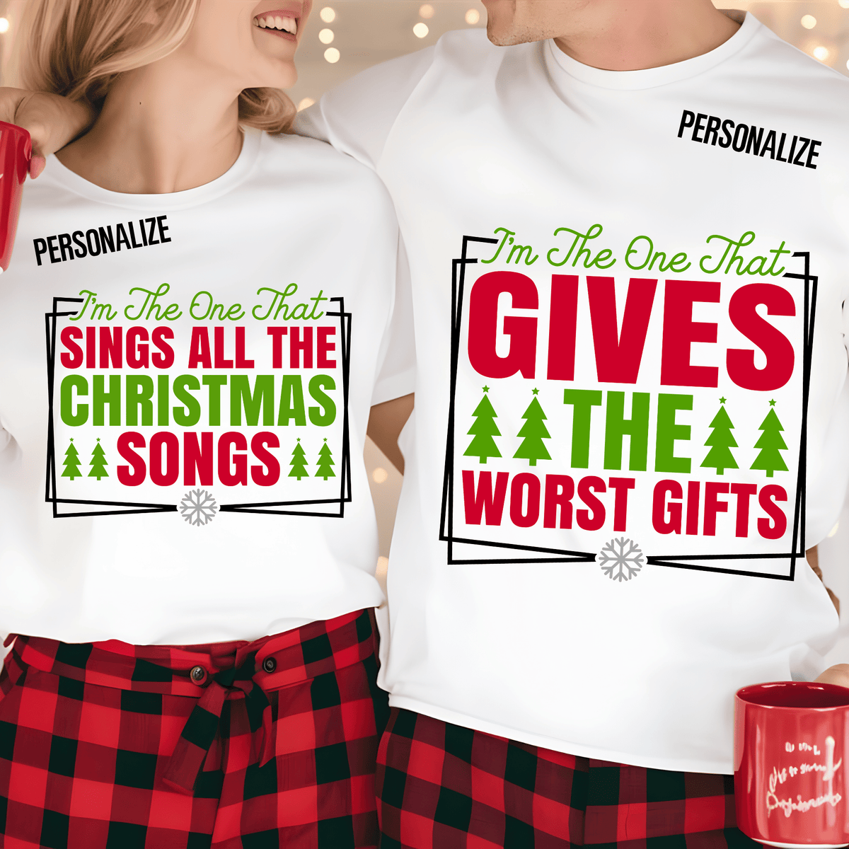 Two people wearing matching white personalized Christmas t-shirts with red and green text and holiday graphics, paired with red plaid pajama pants. One shirt reads 'I'm The One That SINGS ALL THE CHRISTMAS SONGS' and the other reads 'I'm The One That GIVES THE WORST GIFTS'.