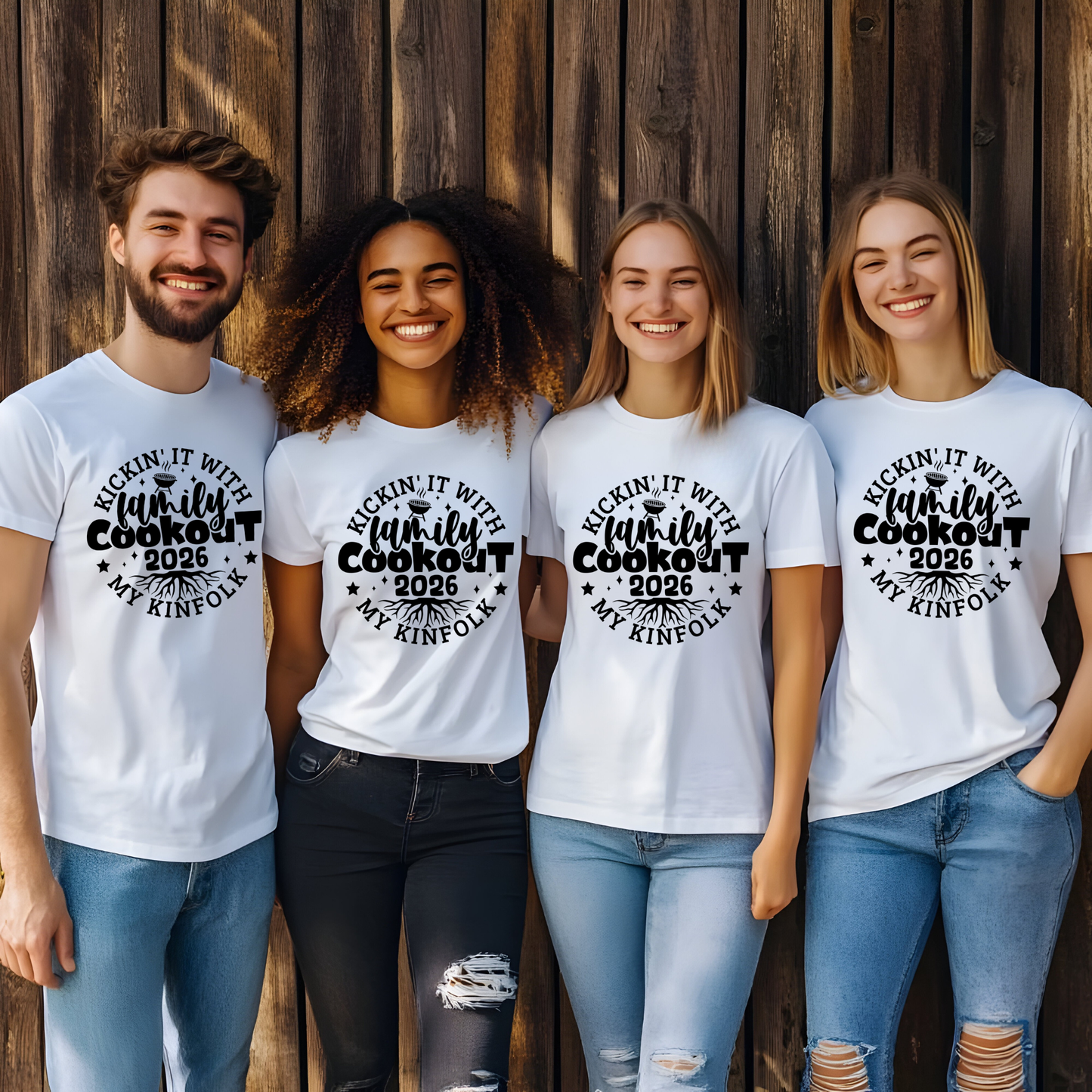 Four people wearing white t-shirts with 'Kickin' it with family cookout 2026' text against a wooden background.